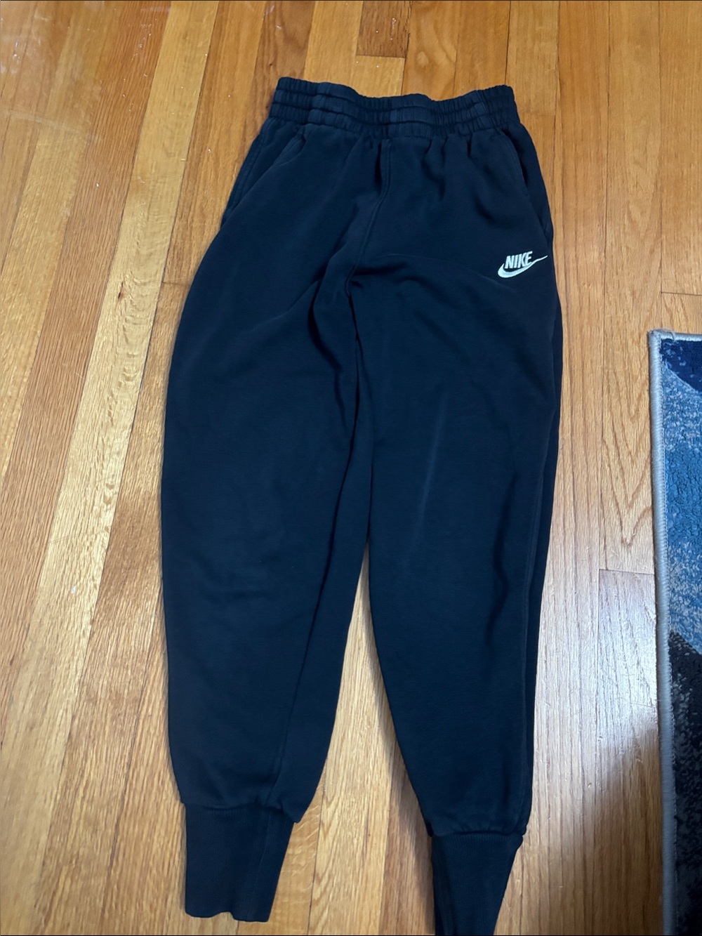 Nike Kids Black Sweatpants with White Swoosh Logo